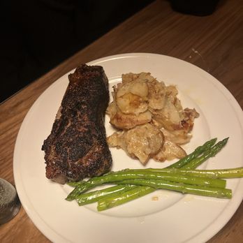 Stubrik's Steakhouse - New York steak with raw asparagus - Steakhouses Near Me - Fullerton, California Stubrik's Steakhouse - New York steak with raw asparagus - Steakhouses Near Me - Fullerton, California