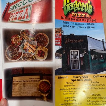 Grecco's - a hand holding a menu - Pizza Near Me - Bedford, Indiana