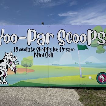 Yoo-Par Scoops - a sign with a cow on it - Mini Golf Near Me - Manistique, Michigan
