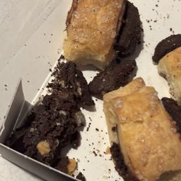 Stale $25 box of 9 pieces of hard as rocks rugelach. No freshness dates on packaging and no freshness sealing to keep air out and crumbs in. Stale $25 box of 9 pieces of hard as rocks rugelach. No freshness dates on packaging and no freshness sealing to keep air out and crumbs in.