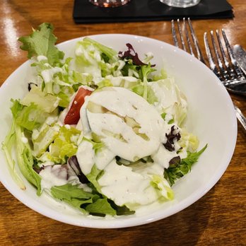 Tuscany Grill - a bowl of salad with dressing - Italian Near Me - Melbourne, Florida Tuscany Grill - a bowl of salad with dressing - Italian Near Me - Melbourne, Florida