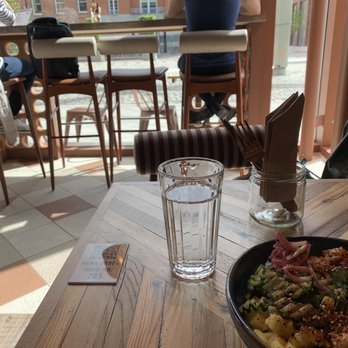 Nutbutter - Interior table facing window with Classic Poke bowl and self-serve tap water - Wine Bars Near Me - Dublin, D