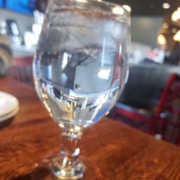 a glass of water on a table