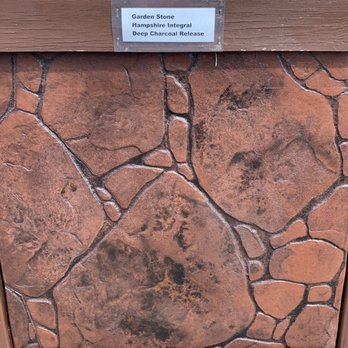 Buckeye Concrete & Design - a sign on a stone wall - Masonry/Concrete Near Me Buckeye Concrete & Design - a sign on a stone wall - Masonry/Concrete Near Me