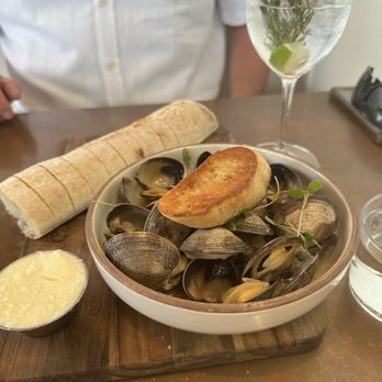 Valentina - Clams and bread with butter. Gin and tonic in the back. - Seafood Near Me - Encinitas, California Valentina - Clams and bread with butter. Gin and tonic in the back. - Seafood Near Me - Encinitas, California
