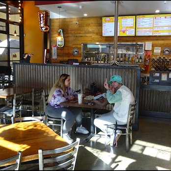 Krush Burger - The dining room is very spacious, modern, and very well lit by natural lighting, thanks to the many floor to ceiling windows. - Burgers Near Me - Roseville, California