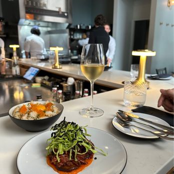 Farra - a plate of food and a glass of wine - Wine Bars Near Me - New York, New York