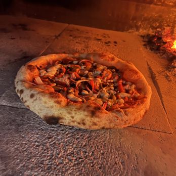Pizza Bosforo - a pizza cooking in a brick oven - Pizza Near Me Pizza Bosforo - a pizza cooking in a brick oven - Pizza Near Me