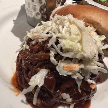 Hard Rock Cafe - The Pulled Pork Sandwich served with coleslaw and beans - American Near Me - Orlando, Florida Hard Rock Cafe - The Pulled Pork Sandwich served with coleslaw and beans - American Near Me - Orlando, Florida