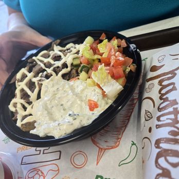 Shawarma Press - Denton - Beef shawarma over half rice and half lettuce with garlic sauce. - Mediterranean Near Me - Denton, Texas Shawarma Press - Denton - Beef shawarma over half rice and half lettuce with garlic sauce. - Mediterranean Near Me - Denton, Texas