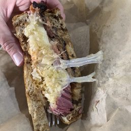 Half of a Reuben. The meat melts in your mouth!! Half of a Reuben. The meat melts in your mouth!!