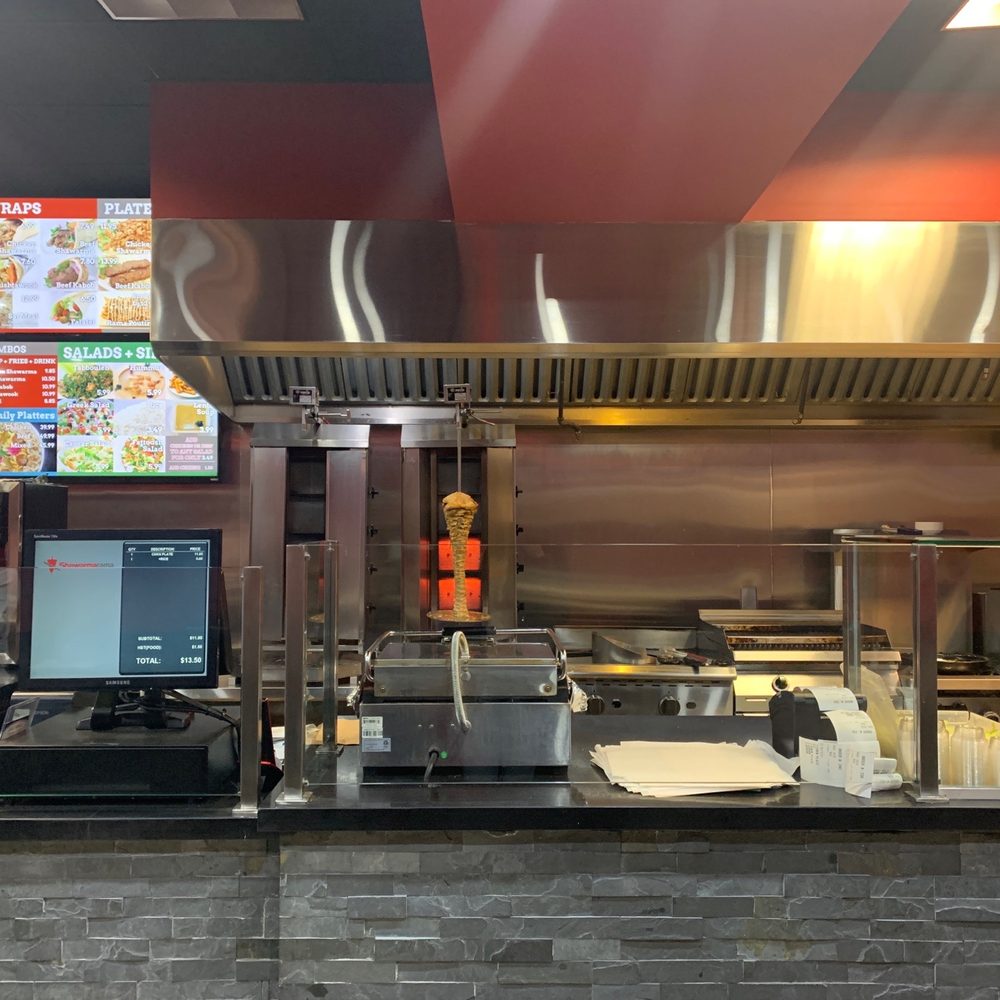 a restaurant kitchen with a lot of counter space a restaurant kitchen with a lot of counter space