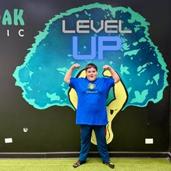 Kid showing off his Level 5 advancement at Mighty Oak Athletic.