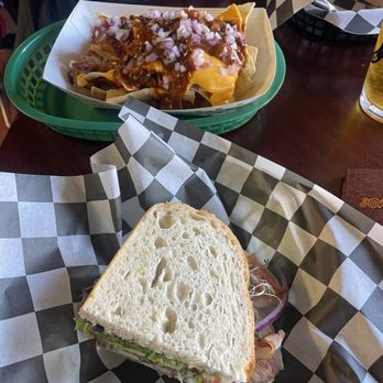 Lone Star Bistro - Half of sandwich and chili cheese nachos - Coffee & Tea Near Me - Lone Pine, California