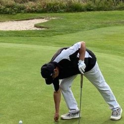 Jensen Beach Golf Club - My buddy Dino fixing his ball mark.