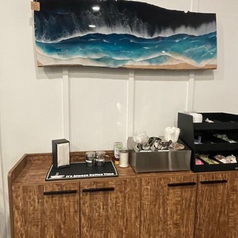 Rise and Grind - a kitchen with a sink and a painting on the wall - Cafes Near Me - Powhatan, Virginia