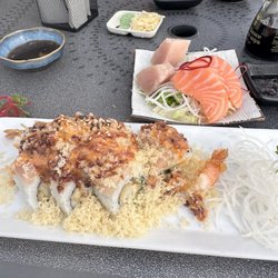 Genki Japanese Cuisine - TNT Roll, tuna and salmon sashimi. In the background is the salmon avocado roll.