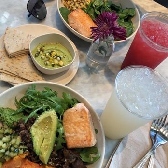 Flower Child - (Bottom to top): Mother Earth bowl with salmon, Avocado Hummus, lemonade, salmon with spinach and quinoa - Salad Near Me - Houston, Texas