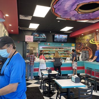 Jupiter Donuts Boynton - a man wearing a face mask in a restaurant - Donuts Near Me - Boynton Beach, Florida Jupiter Donuts Boynton - a man wearing a face mask in a restaurant - Donuts Near Me - Boynton Beach, Florida