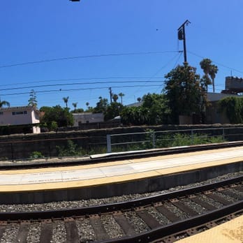 Amtrak Station - The long train occupies the station and beyond, from left the station to all the way to right the traffic intersection - Public Transportation Near Me - Santa Barbara, California