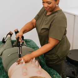Tella Total Wellness - Cupping therapy with percussion massage at Tella Total Wellness - Garden Ridge. A powerful combo to relieve tension, improve circulation.