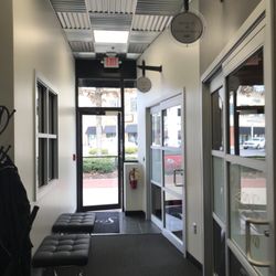 Salon John Francis - Door to enter the building and the closest exit for this salon .