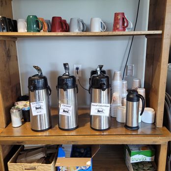 First Street Coffee Station - a shelf of coffee mugs - Bakeries Near Me - Merrill, Wisconsin First Street Coffee Station - a shelf of coffee mugs - Bakeries Near Me - Merrill, Wisconsin