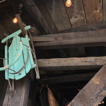 Ironworks Distillery - a blue sled hanging from the ceiling - Beer, Wine & Spirits Near Me - Lunenburg, Nova Scotia