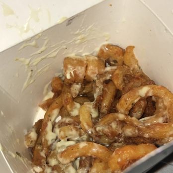 Jack in the Box - Half empty loaded "parm" fries with random black marks inside box - Fast Food Near Me - Tucson, Arizona