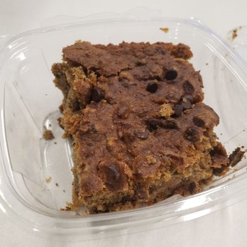 Our New Leaf - Chocolate chick  bar - A rectangular chocolate chip cookie bar with visible chocolate chips in a transparent plastic container. - Bakeries Near Me - Depew, New York