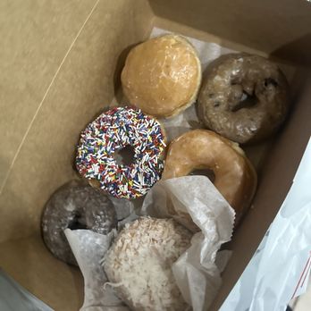The Donut Shoppe - Devil cake, chocolate donut with sprinkles, bavarian, coconut cake, donut glaze and blueberry - Donuts Near Me - Jacksonville, Florida The Donut Shoppe - Devil cake, chocolate donut with sprinkles, bavarian, coconut cake, donut glaze and blueberry - Donuts Near Me - Jacksonville, Florida