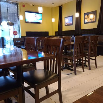 Kurry Zone - tables and chairs in a restaurant - Indian Near Me - Somerset, New Jersey Kurry Zone - tables and chairs in a restaurant - Indian Near Me - Somerset, New Jersey