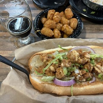 Mad Beach Craft Brewing - Gator po'boy and beer cheese tots. - Breweries Near Me - Madeira Beach, Florida Mad Beach Craft Brewing - Gator po'boy and beer cheese tots. - Breweries Near Me - Madeira Beach, Florida