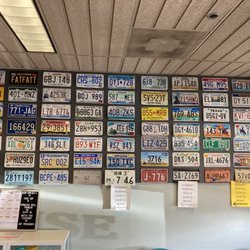 Heights Auto License - They have all these plates on display, but its all for show, as they didn't have a metal plate to give me, after charging me $100 for them.