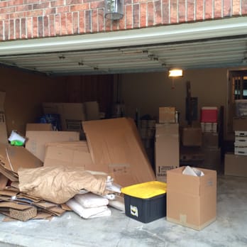 Movemart Relocation - Under neath the pile of boxes are a load of books and other items which weren't boxed. Mixed in are used boxes with other people's names. - Movers Near Me - Columbia, South Carolina Movemart Relocation - Under neath the pile of boxes are a load of books and other items which weren't boxed. Mixed in are used boxes with other people's names. - Movers Near Me - Columbia, South Carolina