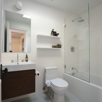 BNH Home Improvement - a bathroom with a toilet, sink, and shower - General Contractors Near Me - Brooklyn, New York BNH Home Improvement - a bathroom with a toilet, sink, and shower - General Contractors Near Me - Brooklyn, New York