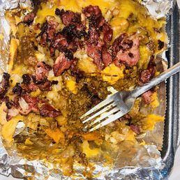 Chili cheese fries with pastrami, grilled onions Chili cheese fries with pastrami, grilled onions