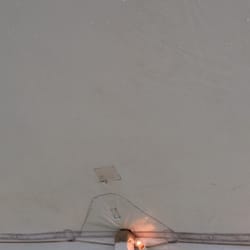 Party Place Rental - Dirt around taped up hole in ceiling of tent. Dirty seems and lights.