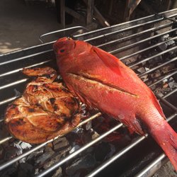 NatTribu - Chicken breast and red snapper being grilled up!