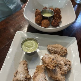 Minnie and John's - Kala (savory sweet corn fritter) and chicken wings w salt and vinegar rub and jalapeño garlic ranch - Cocktail Bars Near Me - New Orleans, Louisiana Minnie and John's - Kala (savory sweet corn fritter) and chicken wings w salt and vinegar rub and jalapeño garlic ranch - Cocktail Bars Near Me - New Orleans, Louisiana