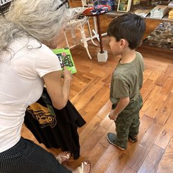 The Clarksville Collection - Jody showing a little customer the coolest thing about this space puzzle.