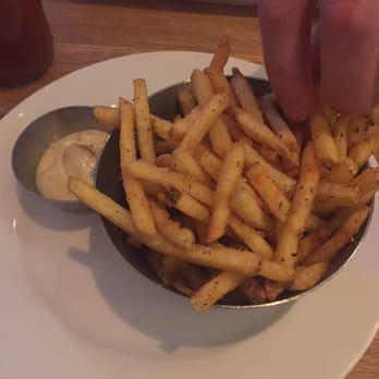 Earls Kitchen + Bar - Truffle fries (notice my husband's impatient hand) - New American Near Me - McLean, Virginia Earls Kitchen + Bar - Truffle fries (notice my husband's impatient hand) - New American Near Me - McLean, Virginia