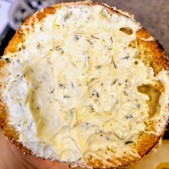 Einstein Bros. Bagels - Onion chive shmear on toasted sesame bagel - Bagels Near Me - Duluth, Georgia