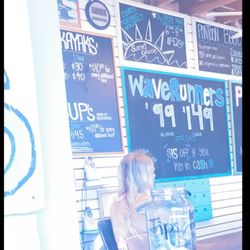 Corolla Water Sports - inside of the booth, showing some of the services they offer like Kayaks, SUP's, Wave Runners, Pontoon boats & more! Don't forget to tip :)