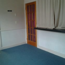 Bella Piel - Waiting area.. door and window to room for facials?