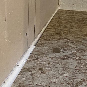 Doc's Restorations - Kitchen countertop with too wide of a gap. Backsplash had to be redone. - General Contractors Near Me - Summerfield, Florida