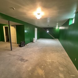 Bryan Construction - Painting of walls in basement.