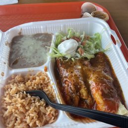 a plate of enchiladas and rice a plate of enchiladas and rice
