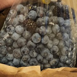 Fruit of The Vine - A bucket of berries put into a bag.