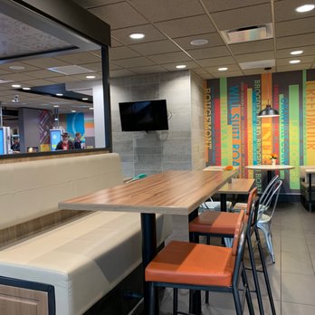 McDonald's - a long table with chairs and a flat screen tv - Fast Food Near Me - Butner, North Carolina McDonald's - a long table with chairs and a flat screen tv - Fast Food Near Me - Butner, North Carolina